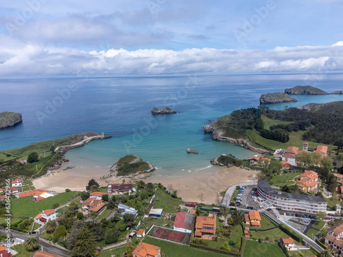 Vacation on Green coast of Asturias, aerial views of Celorio village with sandy beaches, North of Spain