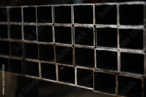 stack​ of square​ steel tubes​ profile or pipes for construction supplies and welding works © tavrox