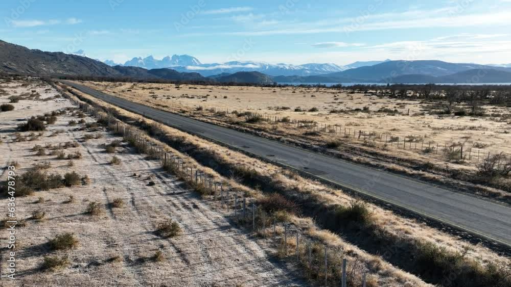 Rural Road At Puerto Natales In Ultima Esperanza Chile. Snowy Mountains. Road Landscape. Ultima Esperanza Chile. Winter Background. Rural Road At Puerto Natales In Ultima Esperanza Chile. Rural Road At Puerto Natales In Ultima Esperanza Chile. Snowy Mountains. Road Landscape. Ultima Esperanza Chile. Winter Background. Rural Road At Puerto Natales In Ultima Esperanza Chile.