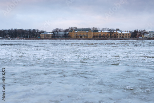 Winter cityscape. Historic city center of St. Petersburg, Russia. View of the building of the Menshikov Palace. Architectural tourist attraction. Ice floes on the Neva River. Cold winter weather.