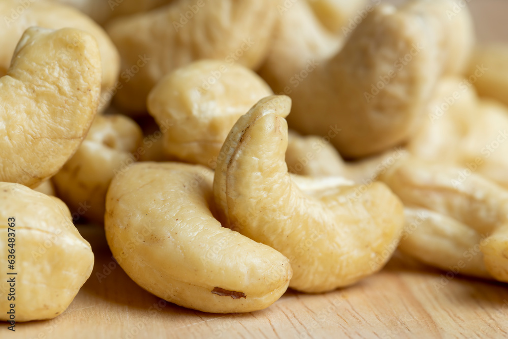 scattered pile of cashew nuts