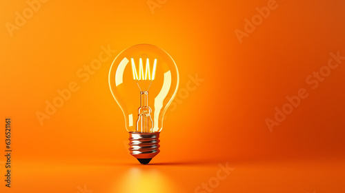 LED filament light bulb with copy space on orange background