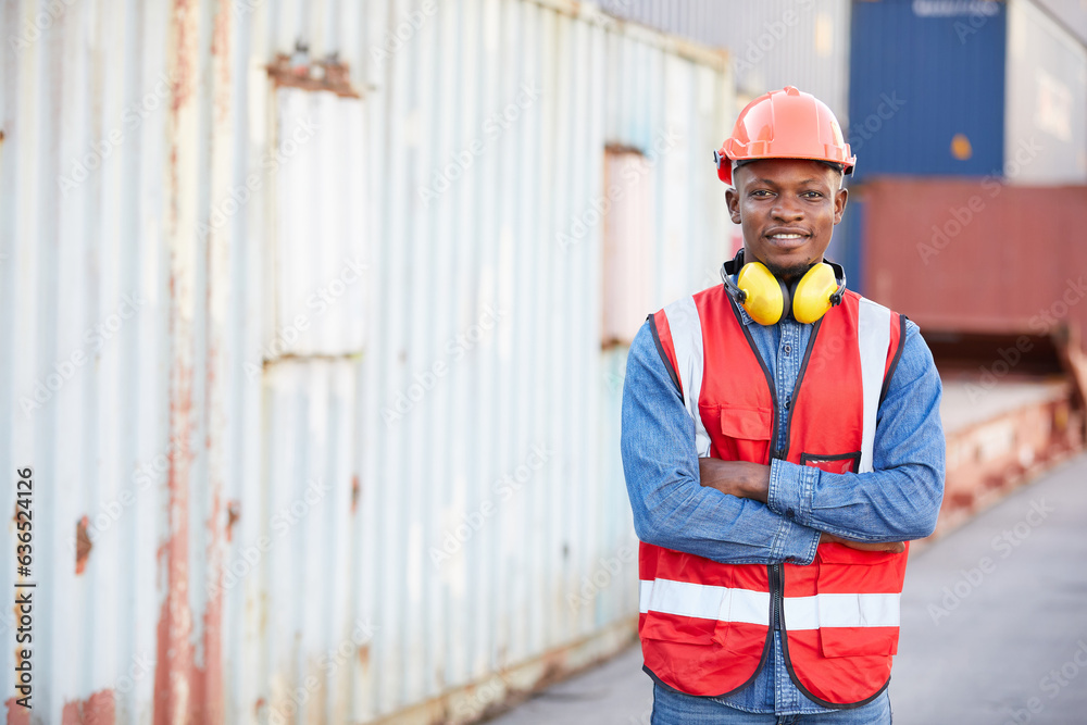 portrait African factory worker or engineer folded arms pose in containers warehouse storage portrait African factory worker or engineer folded arms pose in containers warehouse storage
