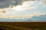 Morning landscape in Ngorongoro crater with clouds coming in over the crater rim, Tanzania