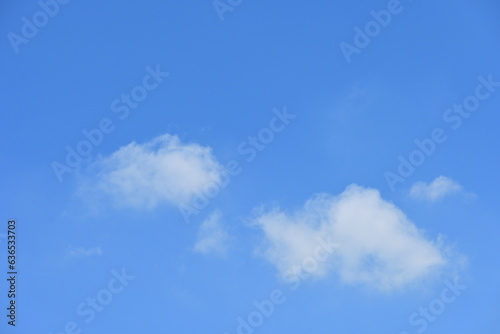 beautiful blue sky and white fluffy group of clouds with sunrise in the morning, natural background