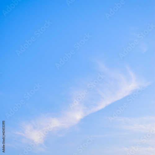 beautiful blue sky and white fluffy cloud with sunrise in the morning, natural background