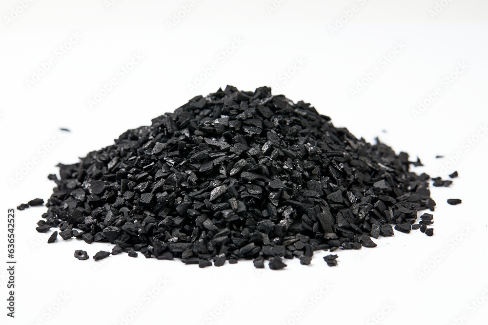 Pile of natural activated carbon scattered isolated on white background. activated carbon is used for effective applications in adsorption, removal of pollutants, water treatment, and energy, etc. Pile of natural activated carbon scattered isolated on white background. activated carbon is used for effective applications in adsorption, removal of pollutants, water treatment, and energy, etc.