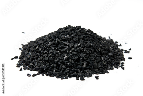 Pile of natural activated carbon scattered isolated on white background. activated carbon is used for effective applications in adsorption, removal of pollutants, water treatment, and energy, etc.