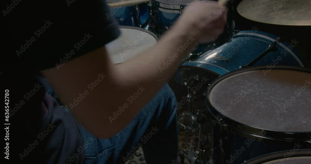 Drummer playing drum set in studio Drummer playing drum set in studio