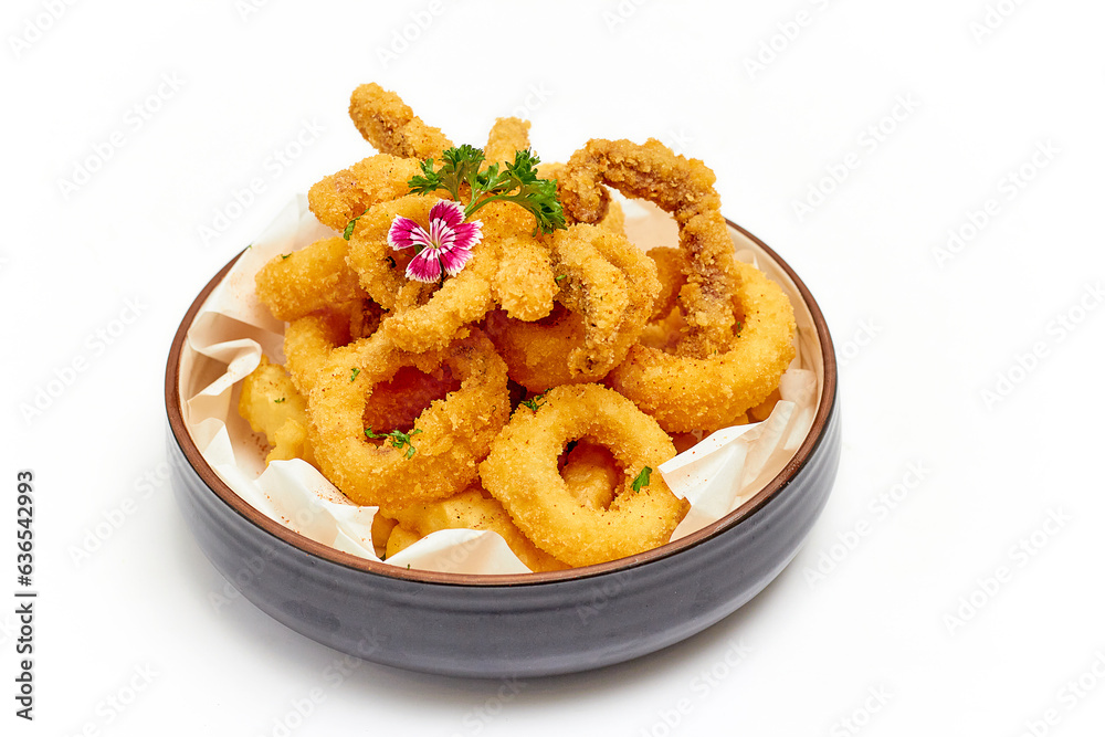 Calamari (deep-fried sliced squid rings) are beautifully decorated with flowers and parsley leaves and served with jagged French fries in a large bowl isolated on white background. Popular Appetizer. Calamari (deep-fried sliced squid rings) are beautifully decorated with flowers and parsley leaves and served with jagged French fries in a large bowl isolated on white background. Popular Appetizer.