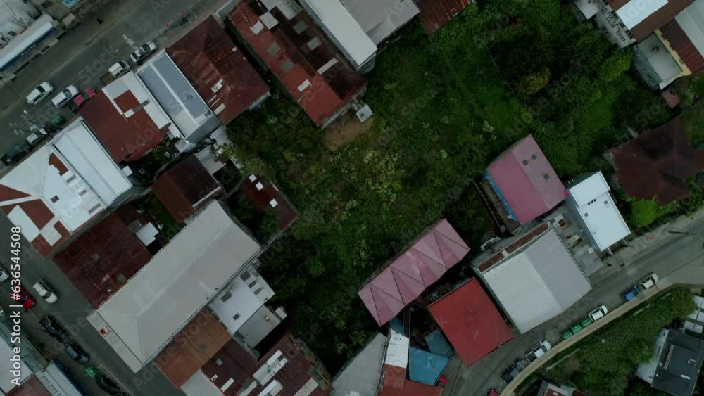 Aerial Tilt Up Shot Of Church In City Against Sky, Drone Flying Over Residential District - Castro, Chile Aerial Tilt Up Shot Of Church In City Against Sky, Drone Flying Over Residential District - Castro, Chile