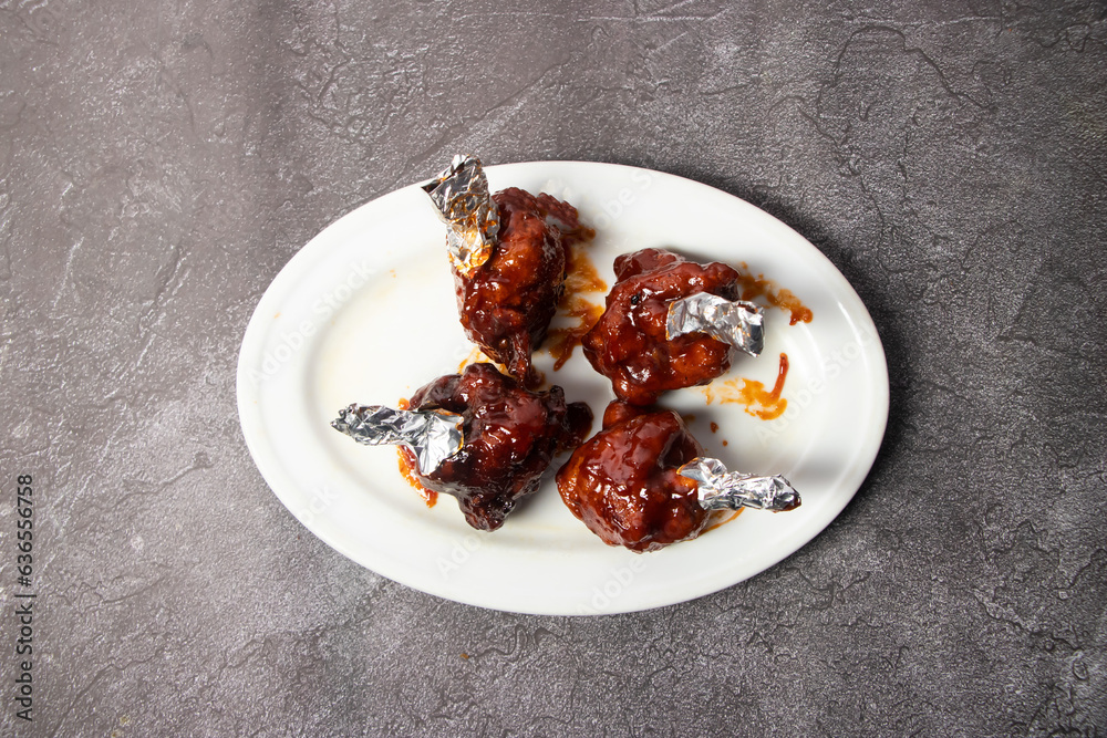 Chicken Lollipop or lolipop served in dish isolated on background top view of bangladesh food Chicken Lollipop or lolipop served in dish isolated on background top view of bangladesh food