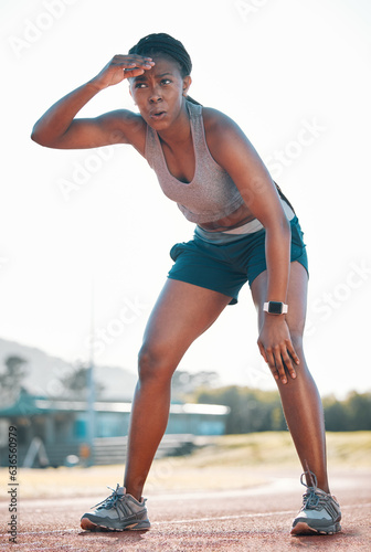 Fototapeta Naklejka Na Ścianę i Meble -  Sweating, tired and black woman at stadium for a race, training or breathing after cardio. Sports, workout and an athlete or African runner with a break after fitness, running or exercise on a track