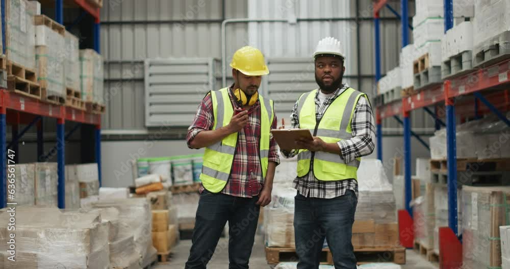 Wharehouse worker discussing about stock data 