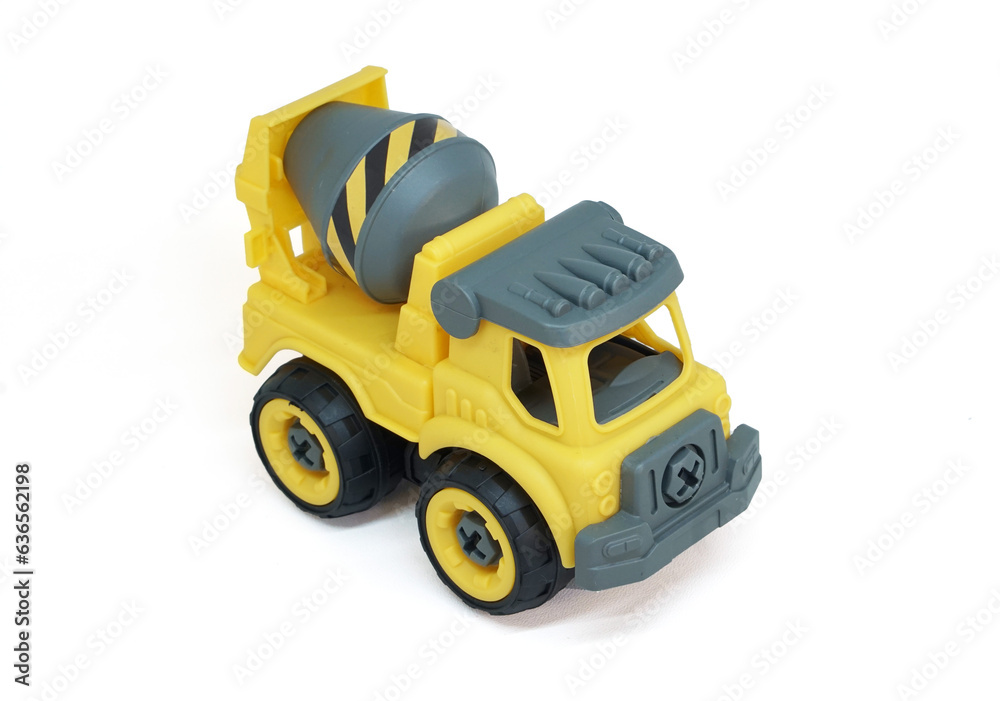 Naklejka premium Yellow plastic concrete mixer truck toy isolated on white background. construction vechicle truck. top view shot.