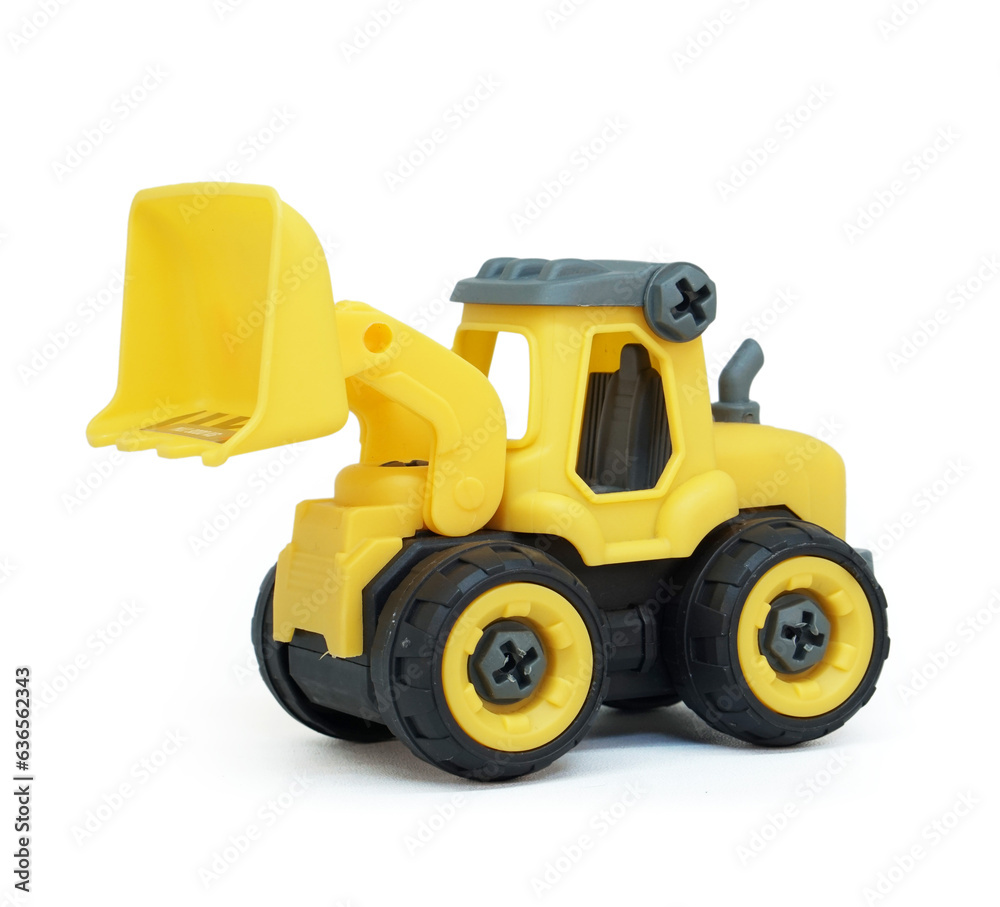 yellow plastic bulldozer toy isolated on white background. heavy construction vehicle toy. yellow plastic bulldozer toy isolated on white background. heavy construction vehicle toy.