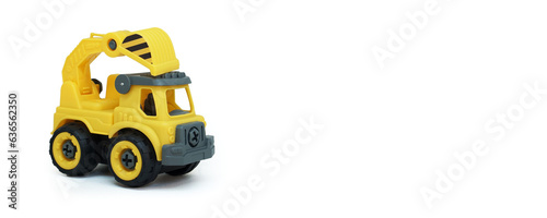 Yellow plastic truck toy isolated on white background. construction vechicle truck. a copy space for banner of toy store.