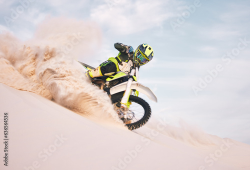Fototapeta Naklejka Na Ścianę i Meble -  Desert, motorbike and person with sports, ride and journey with freedom, training for competition and challenge. Outdoor, driver and rider practice, extreme action and balance on bike on sand dunes