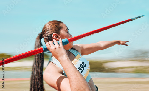 Woman, javelin and athlete in sports competition, practice or olympic training in fitness on stadium field. Active female person or athletic competitor throwing spear, poll or stick in distance