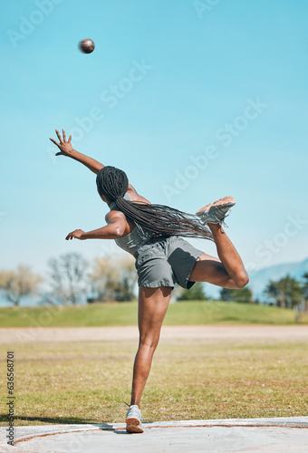 Shot put, woman and athlete throw in competition, challenge or training for field event with metal or steel weight. Throwing, ball or female in athletics sports, games or outdoor olympics tournament photo