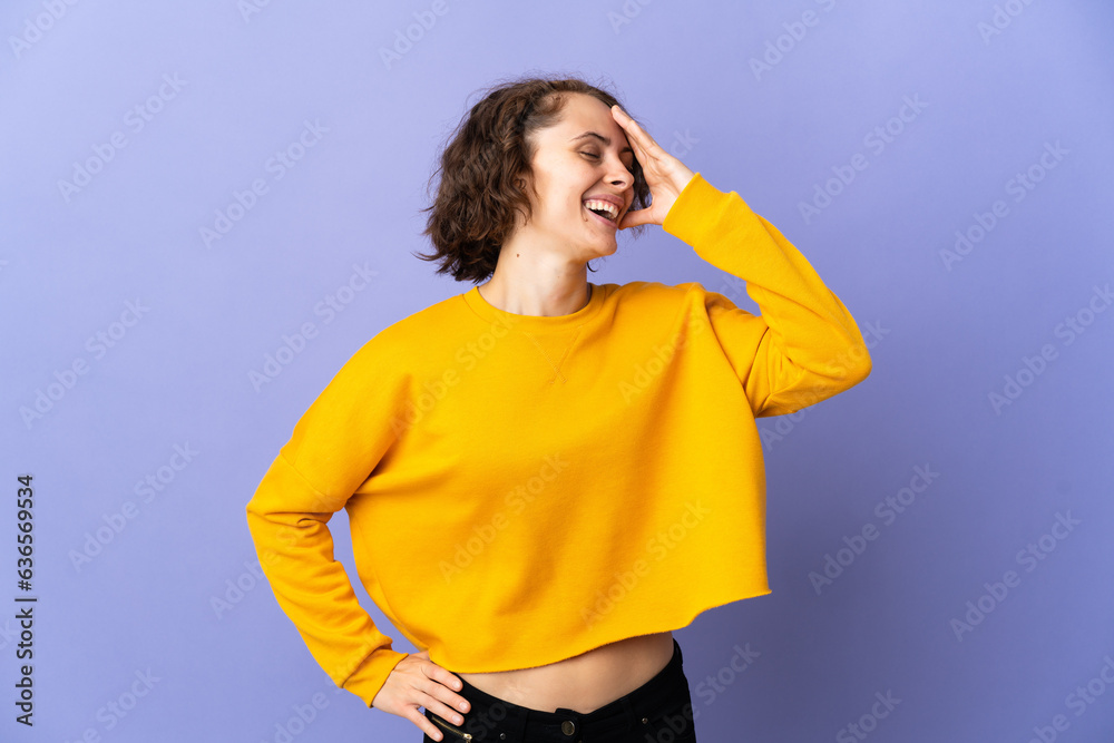 Young English woman isolated on purple background smiling a lot Young English woman isolated on purple background smiling a lot