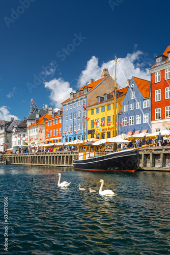 Nyhavn in Copenhagen on a summer afternoon. The colorful facades of the houses create an amazing atmosphere. © PawelUchorczak