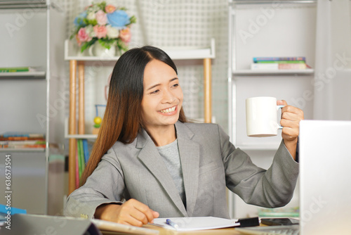 business woman working from home Drink tea to refresh your body.