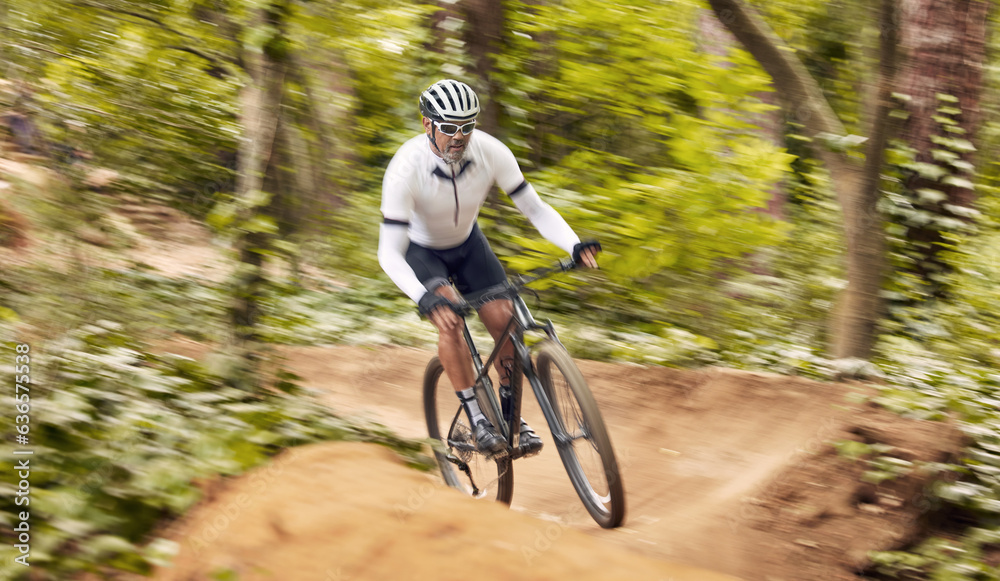 Fototapeta premium Nature cycling, bicycle and sports man travel, ride and journey on off road path, outdoor challenge or exercise. Fast mountain bike, speed blur and athlete training, fitness and workout in forest