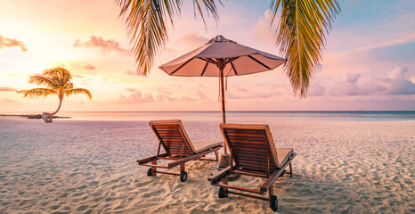 Romantic beach holiday, love couple destination scenic, chairs beds under umbrella, coco palm leaves. Exotic travel coast landscape. Panoramic island paradise vacation. Colorful sea sky, closeup sand