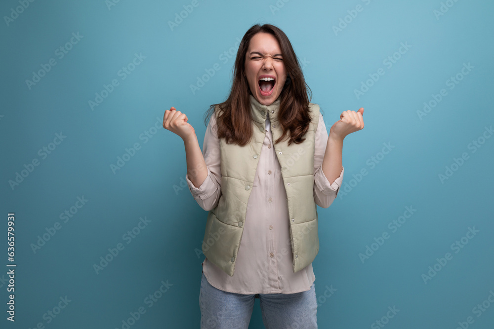 happy cute young brunette woman screaming with joy happy cute young brunette woman screaming with joy