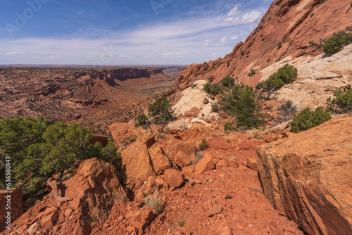 hiking the syncline loop trail in island in the sky district of canyonlands national park, utah, usa