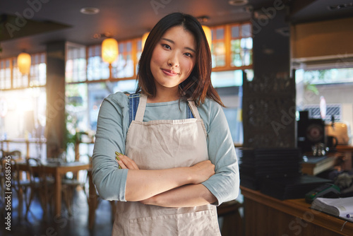 Portrait, asian woman and small business entrepreneur of restaurant with arms crossed for professional service. Cafeteria server, coffee shop waitress or confident manager working in hospitality