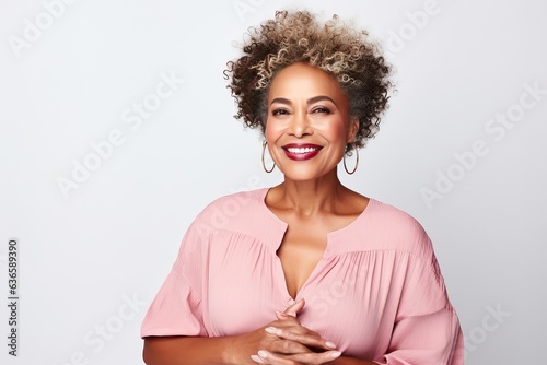 Confident plus size beautiful African American woman in her 50s. Luxurious middle-aged woman with a short gray hairdo looking at camera.