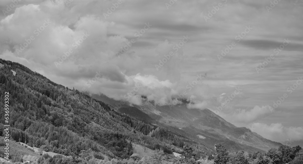 Alps mountains in clouds, black and white Alps mountains in clouds, black and white