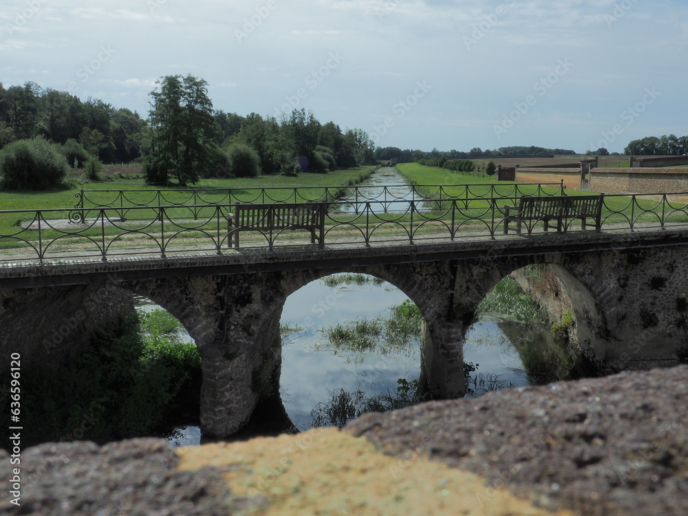 A bridge of the Royneau, tributary of the Eure in Pontgouin near the château de la Rivière, Eure et Loir, France.