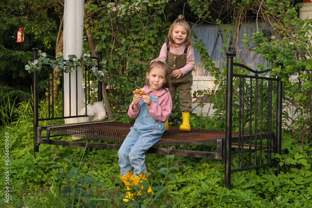 Spectrum of Emotions: While one sister reflects calm and contemplation, the other exudes bursts of joy and excitement. This scene captures the vast range of emotions and temperaments in childhood Spectrum of Emotions: While one sister reflects calm and contemplation, the other exudes bursts of joy and excitement. This scene captures the vast range of emotions and temperaments in childhood