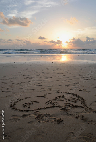 Beach at sunset with heart drawn in sand, Kata beach, Phuket, Thailand