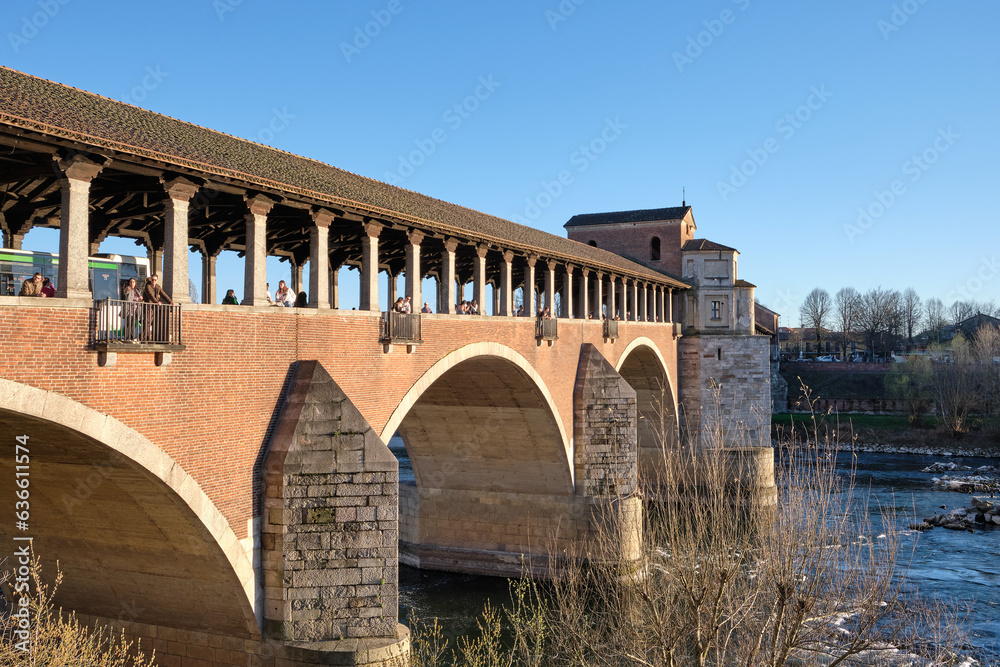 Pavia, Italy April 2023. Ponte Coperto (covered bridge) or the Ponte Vecchio a stone arch bridge over the Ticino River.