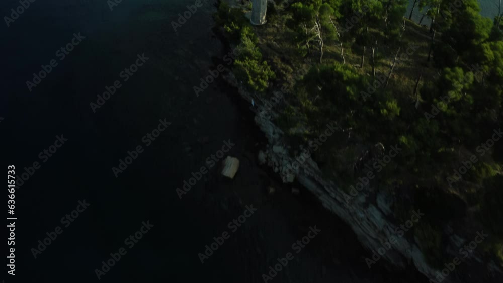 small uninhabited island in the Adriatic Sea, shot by drone, summer, clear sky, early morning, lighthouse small uninhabited island in the Adriatic Sea, shot by drone, summer, clear sky, early morning, lighthouse