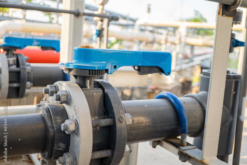 Butterfly manual Valve on the waste water pipe line. The photo is suitable to use for industry background photography, power plant poster and electricity content media.