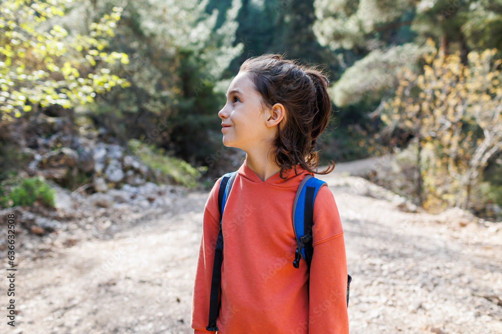 portrait of a child with a backpack outside the city. a boy with a backpack travels. portrait of a child with a backpack outside the city. a boy with a backpack travels.