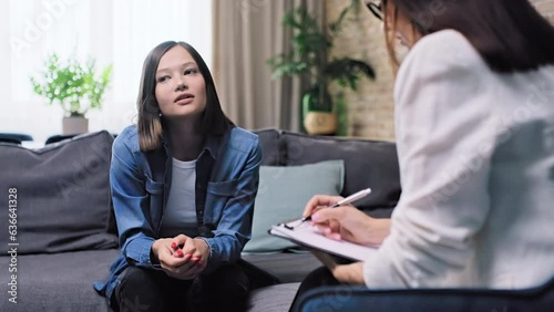 Young woman on therapy session in psychologist's office