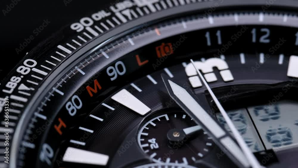 Extreme closeup second arrow passing by on clock face. Closeup real time shot. Running second arrow. Close up macro watch bracelet clasp. Bezel. Closeup view of rotating luxury sports watch. Extreme closeup second arrow passing by on clock face. Closeup real time shot. Running second arrow. Close up macro watch bracelet clasp. Bezel. Closeup view of rotating luxury sports watch.