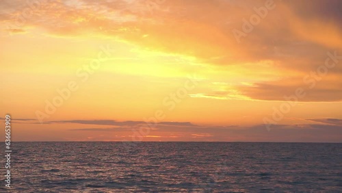Sunset over sea horizon and clouds, hand held