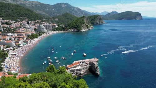 Petrovac na Moru Aerial View. Beaches and coastline of the Adriatic Sea at summer time. Natural landscapes of Montenegro. Balkans. Europe.	 photo