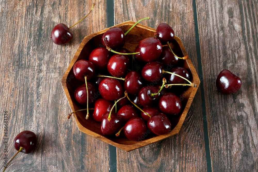 Many cherries on plate on wooden background. Fresh juicy cherries bright background. Sweet cherry, Top view, Many cherries on plate on wooden background. Fresh juicy cherries bright background. Sweet cherry, Top view,
