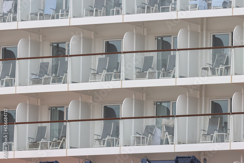 A huge tourist liner - cabin balconies and folding chairs