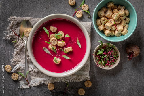 Veggie borsch soup with cream and croutons.