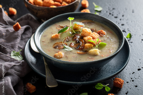 Fotografi Homemade mushrooms soup as hot and aromatic starter.