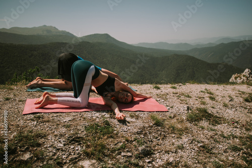 Close up yoga couple on the mountain